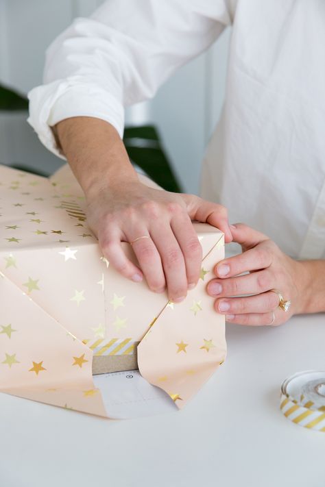 A step-by-step guide to wrapping the perfect present Natal, How To Wrap A Gift Step By Step, Stacked Gift Wrapping, How To Wrap A Present Step By Step, How To Perfectly Wrap A Present, Wrapping A Present, Gift Wrapping How To, Gift Wrapping Step By Step, Step By Step Gift Wrapping