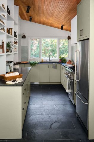 Modern mushroom wood and black kitchen by Anderson Wier Midcentury Slate Floor, Kitchen Black Slate Floor, Mcm Kitchen Black Countertops, Kitchen Dark Tile Floor, Dark Kitchen Floor Tile, Dark Tile Floor Kitchen, Kitchen Black Tile Floor, Black Slate Floor Kitchen, Black Tile Floor Kitchen