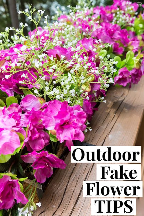 Fake flowers are the way to go if you want fuss free deck railing and flower boxes accenting your home's exterior. Follow these outdoor fake flower tips for nice arranging and to lessen fading from the sun. Outdoor Fake Floral Arrangements, Flower Box Fake Flowers, Window Box Artificial Flowers, Planters With Fake Flowers, Artificial Flowers In Window Boxes, Faux Flowers Window Boxes, Diy Fake Outdoor Planters, Flower Pots With Fake Flowers, Fake Flower Planter Boxes