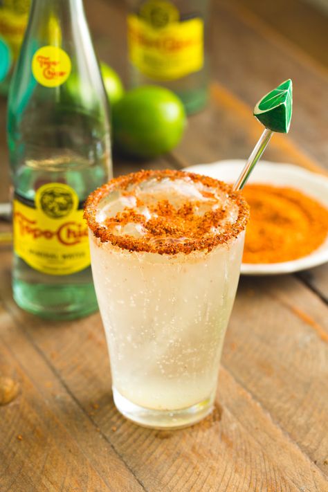 Agua mineral preparada is one of my must-have summer drinks. Agua mineral, fresh lime juice and plenty of Tajin combine perfectly to create a refreshing cooler that helps to beat the Texas heat. #sweetlifebake #sweetlife #sweetliferecipes | sweetlifebake.com @sweetlifebake Topo Chico Drinks Recipes Mocktail, Topo Chico Mock Tail, Topo Chico Drinks Recipes Non Alcoholic, Rusa Drink, Topo Chico Drinks Recipes, Mineral Water Drinks, Mocktails Recipes, Tajin Recipes, Michelada Recipe
