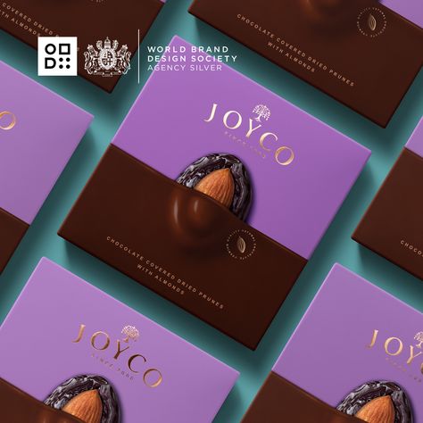 WBDS Agency Design Awards - Silver Award - 2022/23 - Packaging Redesign - Backbone Branding - Joyco - Armenia . In redesigning the face of the packaging, attention has been given to the three main ingredients: chocolate, whole nuts, and dried fruits. The first step was to dip the box in melted chocolate. The surprise treats peek out of the melted chocolate, exposing their bare layers of nuts and fruit. .  #packaging #packagingdesign #agencydesignawards #worldbranddesignawards Chocolate Boxes Packaging, Chocolate Package Design, Chocolate Box Packaging Design, Graphic Design Color Trends, Chocolate Design Packaging, Chocolate Box Design, Dessert Package, Dessert Packaging Design, Packaging Redesign