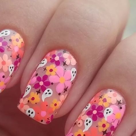 Megan B on Instagram: "Ghosts for #glamnailschallengeoct #nailart #nailartwow #nailartaddict #nailstagram #nailsofig #nailsofinstagram #instanails #instagramnails #notd #nailsdid #nailsoftheday #naildesign #nails2inspire #prettynails #nailswag #nailsonfleek #ghosts #ghostnails #floralnails #halloweennails #freehand #freehandnailart" Groovy Ghost Nails, Tiny Flowers On Nails, Spot Sprite Nails, Lizzy Mcguire Nails, Natural Nail Designs Gel Art Ideas, Soft Flower Nails, Luna Moth Nail Art, Flower Ghost Nails, Cookie Nails Design