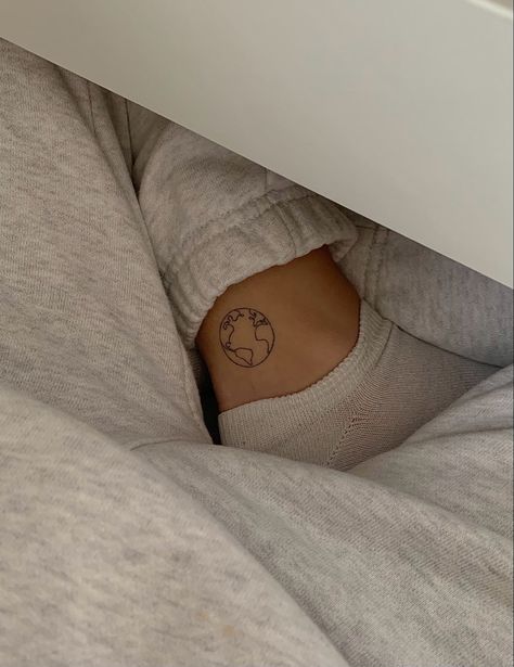 World Tattoos For Women Small, Dainty Globe Tattoo, Below Ankle Tattoo, Dainty World Tattoo, Globe Fine Line Tattoo, Lexi Hidalgo Earth Tattoo, Delicate Minimalist Tattoos, Globe Outline Tattoo, Tiny Globe Tattoo