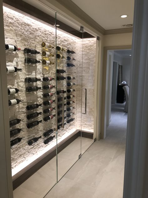 Wine Cooler Room, Wine Storage Modern, Modern Cellar Design, Wine Wall Ideas Home Decor, Wine Storage Room Ideas, At Home Wine Cellar, Glass Wine Cellar Wall Dining Room, Wine Room Lighting Ideas, Modern Glass Wine Cellar