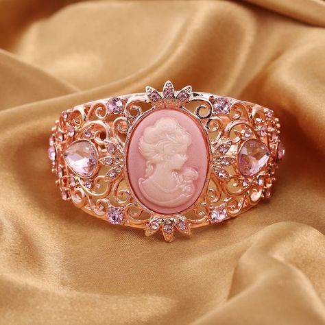 The Precisely Carved Face And Duty Of Lustrous Multi-Gemstones Are Helping The Jewel To Look No Less Than Your Other Special Jewelry Pieces. The Vintage Cameo Adds A Bit Of Curiosity To This Bracelet And The Beautiful Face Of A Woman Carved On The Cameo Surface Provides The Set With Phenomenal Looks. Also, It Is Embellished With Intricate Scrollwork, This Piece Is Quite Novel And Lights Up All Kinds Of Attires. Moreover, The Game Of Multi-Gemstone Makes This Bracelet Looks Expensive, Which Incre Xoxo Jewelry, Gemstone Bangle Bracelets, Antique Costume Jewelry, Glass Bangles, Princess Jewelry, Gemstone Bangle, Rose Tone, Pink Swarovski, Cameo Jewelry