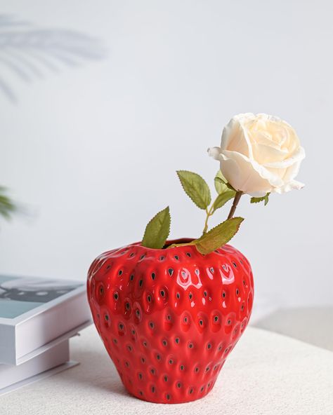 PRICES MAY VARY. Sweet Strawberry Design: This flower vase inspired features a 3D rendition of a strawberry with textured detailing. Its vibrant red color instantly catches attention and adds a touch of vitality. Durable and High-Quality: The unique vase is made of high quality ceramic material, smooth surface, sturdy and durable for long use. Perfect Gift Choice: This strawberry vase is a wonderful gift choice for birthday, housewarming, or any special occasion. Surprise your loved ones with th Strawberry Party Decorations, Strawberry Vase, Girly Home Decor, Strawberry Ceramic, Strawberry Pot, Cute Vase, Girly Home, Strawberry Pots, Ceramic Flower Vase