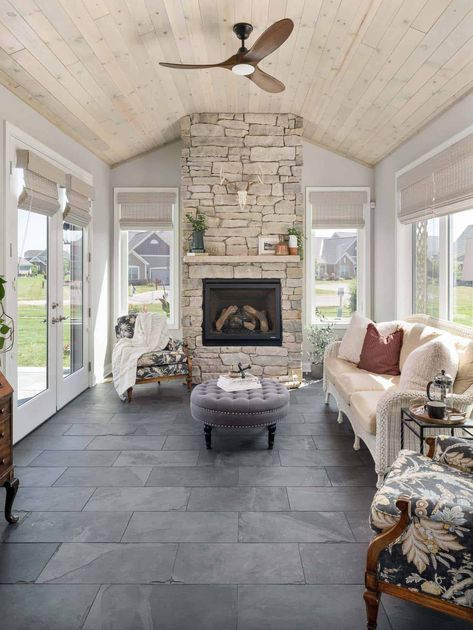 Black Three Season Room, Corner Fireplace Sunroom, 3 Season Room Ceiling Ideas, Four Seasons Room With Fireplace, Sunroom Ceilings Ideas, Fireplace In Screened Porch, 4 Season Room Flooring Ideas, 3 Season Room With Fireplace, Sunroom With Wood Burning Stove