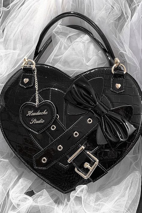 Lolita Heart Shaped Bowknot Buckle Bag Add a touch of sweetness to your wardrobe with our Lolita Heart Shaped Bowknot Buckle Bag. Made with a lovely heart shape and adorned with a beautiful bowknot buckle, this bag is perfect for any romantic, flirty look. Carry your essentials in style and steal the show with this must-have accessory. Size (IN) Width Height Thick One Size 14.17 11.02 3.94 Size (CM) Width Height Thick One Size 36 28 10 Kawaii, Purse Aesthetic, Gothic Bag, Kawaii Bag, Buckle Bag, Buckle Bags, Tea Break, Heart Box, Bags Aesthetic