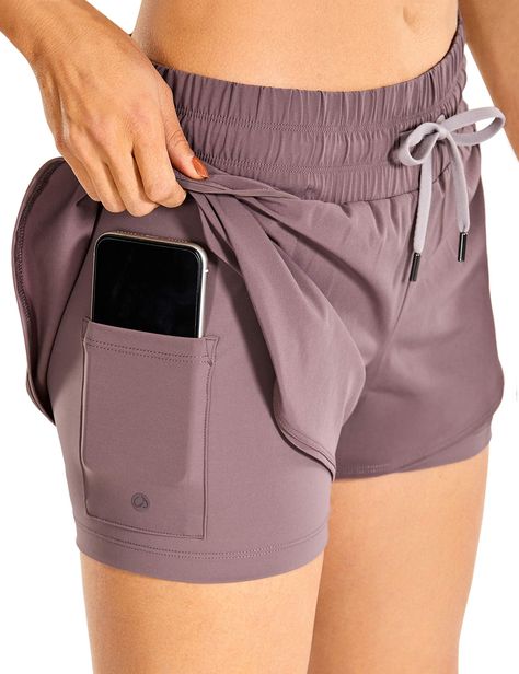 PRICES MAY VARY. Body: 88% Polyester, 12% Spandex; Lining: 69% Polyamide, 31% Spandex Imported Zipper closure 2-in-1 running shorts with inner shorts. Quick-dry, breathable fabric with buttery soft and stretchy liner, give you extra support and provide greater freedom when exercising. Mid-rise elastic waistband with drawstring ensures the comfortable fit. Side split shorts with liner bring unrestrained sports experience Side inner pocket for your phone, zipper waistband pocket could stash the be Gym Fashion Women, Ropa Upcycling, Gymwear Outfits, Sports Wear Fashion, Crz Yoga, Fitness Wear Outfits, Sports Shorts Women, Running Shorts Women, Sport Tennis