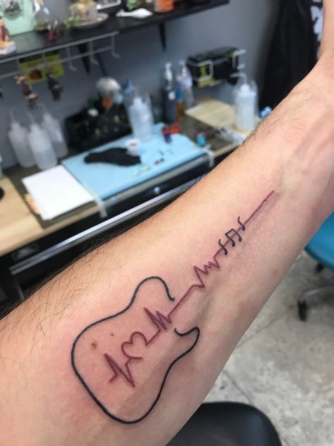 Guitar heartbeat tattoo Guitar Heartbeat Tattoo, Forearm Guitar Tattoo, Guitar Tatoos Small, Music Heartbeat Tattoo, Tattoo Ideas Guitar, Bass Guitar Tattoo, Electric Guitar Tattoo, Guitar Tattoo Designs, Tattoos For Music Lovers