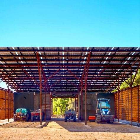 The LSX Module System acting as both the primary roof and the renewable energy generator.

Creating a beautiful example of sustainable architecture, this structure also collects rainfall to irrigate trees and adjacent grazing meadow as well as providing covered storage. Constructed from reclaimed oil field pipe, this unique steel structure has earned many prestigious awards for design and building. Solar Canopy, Pipe Fence, Pacific Northwest Style, Roof Canopy, Steel Architecture, Perforated Steel, California Vineyards, Solar Cover, Canopy Architecture