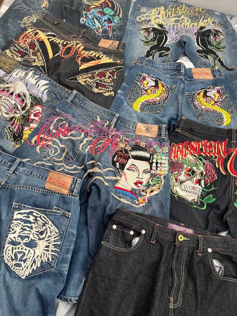 Jeans With Graphics, Ed Hardy Jeans Y2k, Christian Audigier Outfit, Baggy Graphic Jeans, Ed Hardy Jeans Aesthetic, Y2k Jeans Design, Embroidered Jeans Y2k, Jeans Design Ideas Men, Ed Hardy Clothing