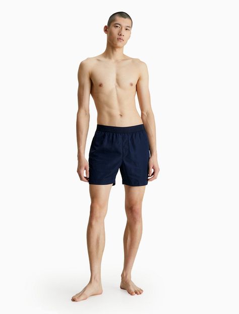 Featuring minimal styling, this swim brief is designed with a tonal elastic waistband for a clean look. Made with a medium rise waist and styled with slip pockets at the sides. Finished with a Calvin Klein logo detail along the waistband. Logo ph... Standing Poses Reference Male, Male Model Standing Poses, Mens Body Reference, Man Figure Reference, Standing Man Pose, Standing Pose Men, Male Standing Reference, Body Reference Poses Man, Pose Reference Male Standing