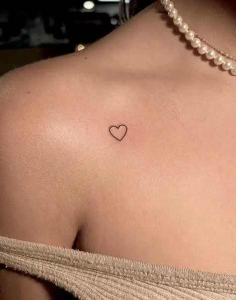 The Best 53 Small Heart Tattoo Designs You’ll Never Get Tired Of - Psycho Tats Mini Tattoo Ideas Female, Minimal Tattoo Design Women, Insert Here Tattoo, Tattoo Ideas Mini, Mini Tattoos Cute, Mini Tatooes Idea, Heart Tattoo Collar Bone, Small Cool Tattoos For Women, Cute Tiny Tattoos With Meaning