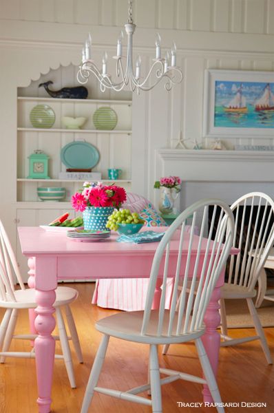 A hot pink dining table with white Windsor bow back chairs add classic cottage style. Colorful Kitchen Table And Chairs, Pink Kitchen Chairs, Fun Dining Table, Pink Dining Room Chairs, Pink Kitchen Table, Colorful Kitchen Table, Painted Dining Table And Chairs, Shabby Chic Dining Room Table, Pink Dining Room