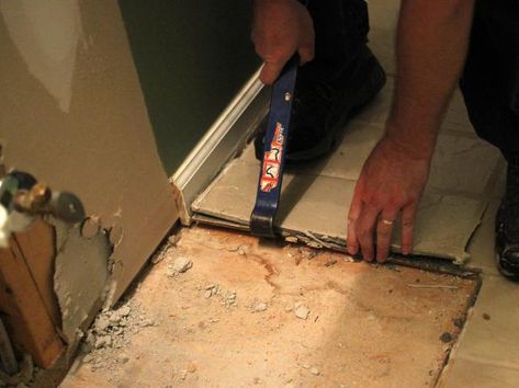 DIYNetwork.com explains how to remove a tile floor with these step-by-step instructions. Even beginning DIYers can tackle the job using these easy-to-follow techniques. Remove Tile Floor, Removing Bathroom Tile, Removing Floor Tiles, Ceramic Tile Floor Kitchen, Tile Basement Floor, Remove Tile, Best Flooring For Basement, Tile Diy, Tile Floor Diy