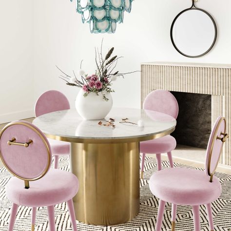 Dine in glamorous style with the Kylie dining chair. Fully upholstered in plush velvet and complemented by gold-tipped legs, it boasts generous padding to keep you comfortable. Available in multiple color options. Product Overview Available Colors: Bubblegum, Black, Grey and Sea Blue Size: 21"W x 22.4"D x 37.2"H Primary Material: Velvet Leg Material: Birch, Stainless Steel Weight: 19.5 lbs Country of Origin: China Seating Details Seat Height: 19.7" Seat Width: 20.7" Seat Depth: 17.3" Leg Height: Deco Violet, Marble Dining Room, Black Velvet Chair, Blue Velvet Dining Chairs, Velvet Dining Chair, Dine In, Marble Dining, Glamorous Style, Furniture Care