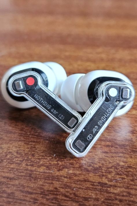 The Nothing Ear (2) are 'nothing' short of effective. The earbuds are able to deliver a pleasantly versatile listening experience, complemented by a design that feels subversive, and a comfortable fit. Are the buds worth ₹9,999? In this review, I discuss its performance, design, and battery. IndiatimesDesignFrom the get-go, the design will seduce you. The edgy charging case carries forward the aesthetic of the previous gen earbuds and the Nothing Phone (1), while packing it into a lightweight pa Indie Pop, Ear Phones Aesthetic, Nothing Phone, Iphone Obsession, Small Case, Smart Phones, Noise Cancelling, Best Songs, A Design