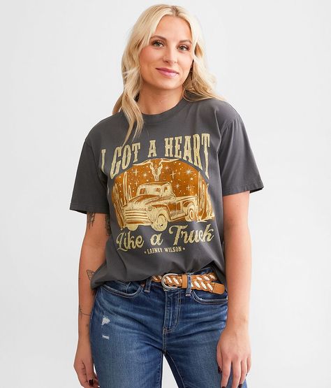 Lainey Wilson I Got A Heart Like A Truck Band T-Shirt - Grey Large, Women's Black Distressed graphic washed t-shirt Bust measures 39 on size small Body length 25 1/2 on size small. 100% Cotton. Machine wash cold. Do not bleach. Tumble dry low. Do not iron decoration.. Measurements: Bust -Fullest part of bust with arms at sides. Waist -Circumference of natural waist: above belly button below rib cage. Hips -Standing with feet together fullest part of hips. WOMEN'S TOP SIZE CONVERSION CHART Size U Lainey Wilson Shirts, Heart Like A Truck, Lainey Wilson, Heart Band, Tshirt Bag, Iron Decoration, Waist Circumference, A Truck, Conversion Chart