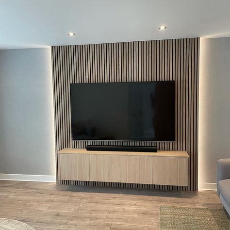 Black Wood Panel Tv Wall, Vertical Wood Slat Wall Behind Tv, Tv Wall Wood Slats, Large Tv Accent Wall, Media Wall Wood Slats, Acoustic Panel Media Wall, Media Wall With Wood Panelling, Wall Paneling Behind Tv, Panel Living Room Wall