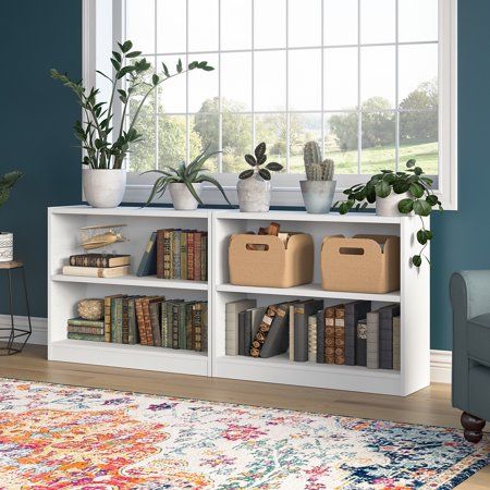 The Bush Furniture Universal Small 2 Shelf Bookcase - Set of 2 provides a versatile organization solution that makes it easy to show off your personal library or brighten up the room with pictures and decorations. Perfect for residential and professional use, this durable horizontal bookshelf is designed to excel anywhere flexible storage and display capacity is needed. A one-inch thick adjustable shelf prevents sagging and moves up and down to accommodate larger items like binders and photo alb 2 Shelf Bookcase, Low Bookshelves, Low Bookcase, Small Bookshelf, Small Bookcase, Homeschool Room, Stables Design, White Bookcase, Shelf Bookcase