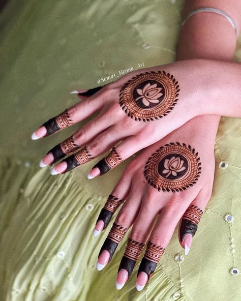 23 Wedding Nail Ideas for Brides That'll Steal The Show Lotus Circle Mehndi Designs, Lotus Mehendi Designs For Hands, Mehndi Designs Lotus, Simple Mehndi Outfit, New Mehndi Designs Bridal, Lotus Mehendi, Mehndi Art Designs Back Hand, Lotus Henna Design, Simple Mehndi Designs Palm