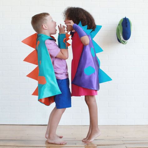 57 Perfect Kids' Halloween Costume Ideas For BFFs Dinosaur Costume Capes Dinosaur Costume Capes ($45) Dino Family Costume, Toddler Dragon Costume, Dino Clothes, Toddler Dress Up Clothes, Dragon Masks, Kids Dragon Costume, Dragon Cape, Big Brother Gifts, Kids Dinosaur Costume