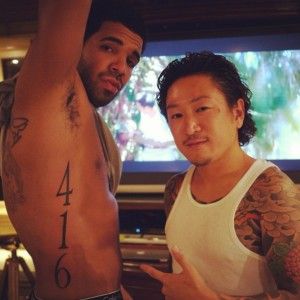 Drakes 416 tattoo on his side - see what the number means to him - http://www.popstartats.com/drake-tattoos Drake, Toronto, Black, Tattoos, The One, Drake Tattoo, Tattoo On, Black And White, White