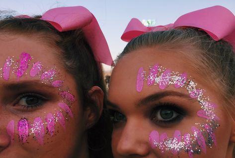 Face paint and glitter for the big Pink Out football game! #pinkout #cheer Game Day Face Glitter, Glitter In Hair Football Game, Pink Out Cheer Makeup, Pink Out Game Cheerleaders, Pink Out Hair Spirit Week, Glitter Face Paint Football Game, Glitter Cheer Makeup, Gameday Makeup Cheer, Usa Face Paint Football Game