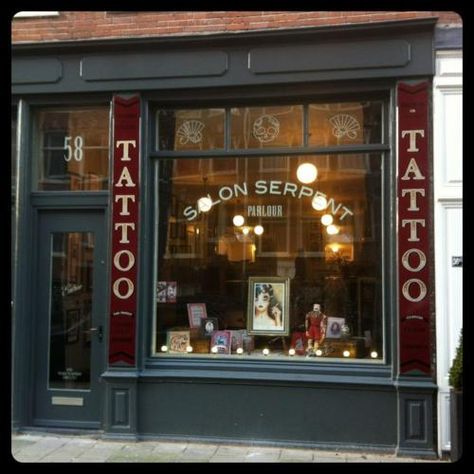 Storefront of the Salon Serpent Parlour in Amsterdam. I'm aiming for more script on the outside. Whadda ya think? Irish Symbol Tattoos, Vines Tattoo, Tattoo Shop Interior, Tattoo Shop Decor, Tattoo Studio Interior, Flower Vine Tattoos, Tattoo Hip, Amsterdam Tattoo, Tattoo Salon