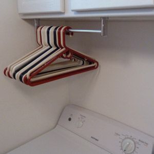 15 Nifty Uses for a Paper Towel Holder - One Crazy House Clothes Hanger Storage, Holding Paper, Laundry Room Storage Shelves, Room Storage Diy, Crazy House, Hanger Storage, Laundry Closet, Small Laundry Room, Small Laundry