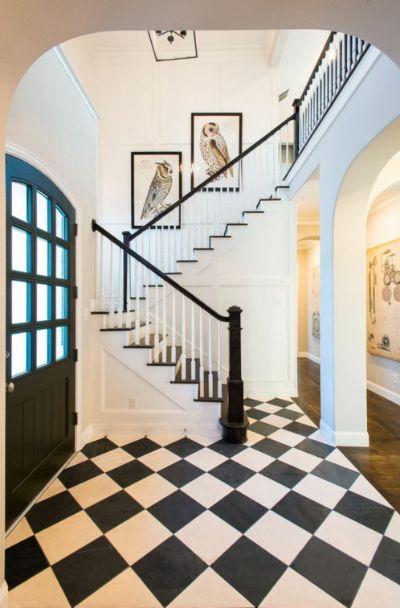 31 Houses With Black Front Entry Door Ideas - | Sebring Design Build Black And White Hallway, Black Exterior Doors, Interior Door Colors, Wood Stair Treads, White Hallway, Entryway Tile, White Staircase, Foyer Flooring, Checkered Floors