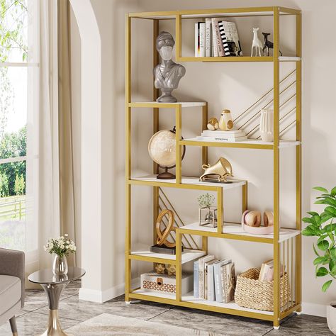 PRICES MAY VARY. EXTRAORDINARY CAPACITY: The Tribesigns 70.9 Inches Modern Bookshelf boasts an impressive 8-tier storage capacity, providing ample space for a range of items, from books and photos to decorative pieces and memorabilia. With dimensions of 11.81"D x 39.37"W x 70.87"H. STYLISH AND CONTEMPORARY DESIGN: Characterized by its staggered shelves and white faux marble finish, the bookshelf enhances any space with a modern, sophisticated touch that effortlessly complements various interior Staggered Bookshelf, Marble Shelves, Gold Bookshelf, Display Bookshelf, Tall Bookshelf, Tall Bookshelves, Gold Shelves, Rococo Furniture, Stable Design