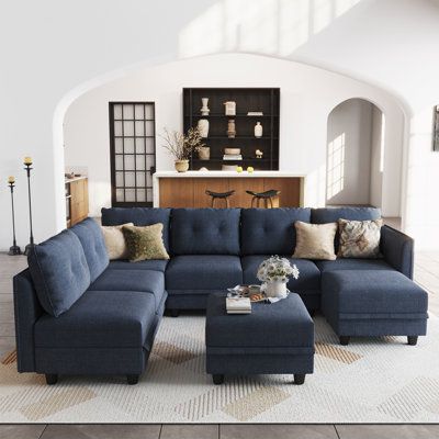 This generous modular sofa living room set brings retro-modern style and contemporary allure to your living space. Featuring velvet-touch thick polyester fabric, water resistant and stain resistant. modular pieces with high-density foam and pocketed springs, and a eucalyptus frame with plenty of weight-bearing capacity offer a luxury seating experience. Body Fabric: Navy Blue Polyester Blend | Blue Sectional - Latitude Run® Zendajas 8 - Piece Modular U-Shape Sectional Sofa w / Ottoman Denim, Pol Costco Modular Sectional, Navy Blue Sectional Living Room Ideas, Living Room Decor Blue Sofa, Navy Blue And Grey Living Room, Navy Blue Sectional, Modular Sofa Living Room, Sectional Living Room Layout, L Shaped Sectional, Blue Couch Living Room