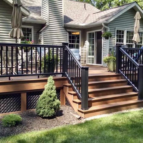 Exterior Small House Ideas, Two Tone Wood Deck, Side Of Deck Landscaping, Wood Decks Backyard, Under Deck Stairs Storage, Brown And Black Deck, Multilevel Deck Ideas Layout, Small Back Deck Ideas, Decks With Roofs