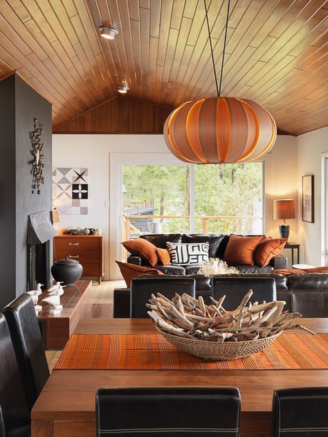 Not digging the black mantle, but I like the orange accents.   25 Amazing Orange Interior Designs Orange Living Room, Beach Style Living Room, Island Cottage, Autumn Interior, Cottage Retreat, Charming Cottage, Living Room Orange, Interior Design Per La Casa, Orange Interior