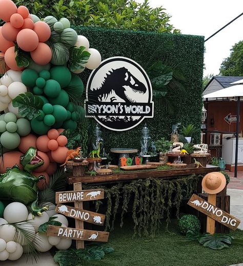 Throw a little dino-mite bash with decor inspired by the movie Jurassic Park! Let these fun ideas help you "build" the perfect party. #LavishMoments #KidsBirthday #Balloons #KidsBirthdayParty #SmallBusiness #BalloonArch #BalloonGarland #ToddlerParty #EventPlanning #BalloonDecor #BalloonStylist #ModernBalloons #LuxeBalloons #BirthdayBalloons #BalloonInspo #JurassicPark #JurassicWorld #JurassicWorldParty #JurassicParkParty #Dinosaur #DinosaurParty #JurassicParkBirthday #ParqueJurasico Jurassic World Balloon Arch, Jurassic Park Outdoor Decorations, Jurassic Park Photoshoot, Jurassic Park Party Balloons, Jurassic Park Balloon Decor, Dino Party Balloons, Jurassic World Balloon Garland, Jurassic Park Balloons, Jurassic Park Balloon Arch