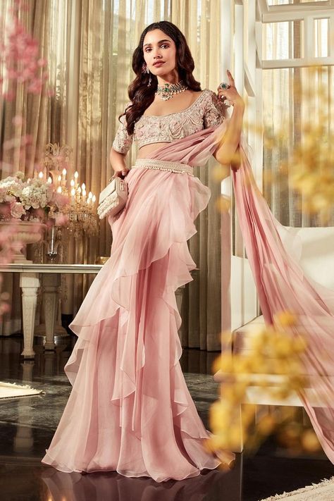 Buy light onion #pink pre-draped #saree with #ruffle hem. Comes with scoop neckline #floral embroidered #blouse & #tassel #embellished belt by #RidhiMehra at #AzaFashions Shop online now at #Azafashions.com Call +91 8291990059 or email contactus@azafashions.com for enquiries. #wedding #festive #ethnic #tradional #shopping #shoponline #party #reception #bride Saree Chiffon, Onion Pink, Ridhi Mehra, Sangeet Outfit, Draped Saree, Net Blouse, Fancy Sarees Party Wear, Net Blouses, Modern Saree