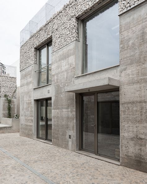 corpo atelier unveils three exposed concrete and stone facades in portugal Exposed Concrete Facade, Mad Architects, 2023 Picture, Faro Portugal, Concrete Facade, Metal Grid, Stone Facade, Concrete Stone, Exposed Concrete