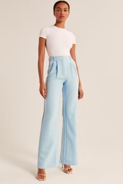 Trending: Blue is About to Take Over Your Closet | The Everygirl Light Blue Trousers Outfit, Blue Trousers Outfit, Light Blue Dress Pants, Sloane Tailored Pant, Tailored Pants Women, Blue Pants Outfit, Casual Pants Women, Women Trousers Design, Light Blue Pants