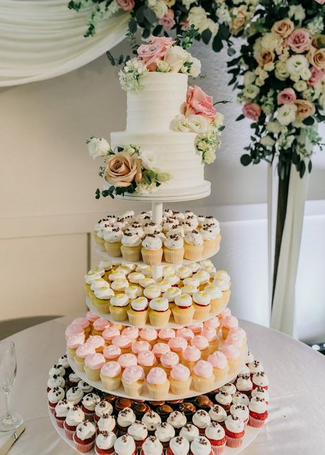 Wedding Cakes Simple Elegant Classy Pretty Cupcakes, Wedding Cake Cupcakes Display, Boho Cake And Cupcakes, Giant Cupcake Wedding Cake, Quince Cake With Cupcakes, Cupcake Cake Tower, Cupcake Tower For Wedding, Wedding Cake With Cupcake Tiers, Two Tiered Wedding Cake With Cupcakes