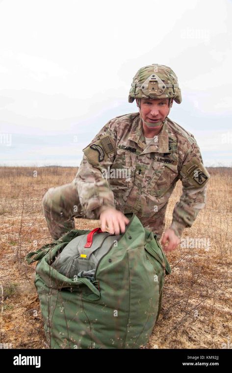 Download this stock image: U.S. Army Maj. Gen. Paul Lacamera, deputy commanding general of the XVIII Airborne Corps, recovers his parachute during the 20th Annual Randy Oler Memorial Operation Toy Drop, at Fort Bragg, North Carolina, Dec. 2, 2017. This year, eight countries are participating and they include; Colombia, Canada, Latvia, the Netherlands, Sweden, Italy, Germany, and Poland. Operation Toy Drop, hosted by the U.S. Army Civil Affairs & Psychological Operations Command (Airborne) is the Paul Lacamera Videos, Paul Lacamera, Fort Bragg North Carolina, American Military, Major General, Fort Bragg, Military Heroes, Men In Uniform, Photo To Video