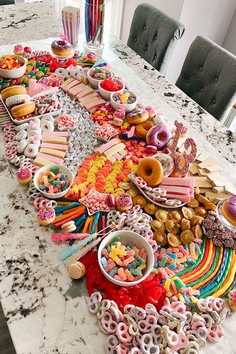 A candy table that is like a charcuterie board but made out of candy and small mini dessert items, the theme was colorful for a 13th birthday party Birthday Candy Board, Birthday Charcuterie, Birthday Sleepover Ideas, Candy Board, Bar A Bonbon, Candy Land Birthday Party, Birthday Snacks, Sleepover Birthday Parties, Candy Birthday Party