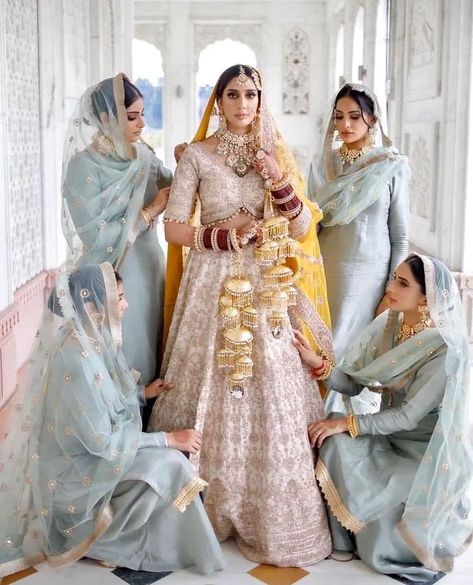 You and your girl gang have been fantasizing about this moment since forever and these bridal squad pictures are meant to be pinned right away. Whether candid or plandid, these bride and bridesmaids pictures are truly setting some major goals. You obviously need to show-off your bestie’s wedding on the gram and there is absolutely no better way than these bride tribe pictures. Get Ready To Steal Some Major Ideas From These Bridal Squad Pictures That We Are Drooling Over –  1. Bridesmaids Who Co Bridesmaids Photoshoot, Desi Bridesmaids, White Bridal Lehenga, Pakistani Bridesmaids, Tailored Outfits, Bride And Bridesmaid Pictures, Jewellery Makeup, Different Opinions, Bridesmaid Poses