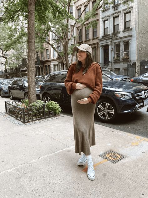 Bump-Friendly Fall Outfits- maternity, maternity outfits ideas, bump style, women's fashion, style, fashion, midi skirt, hat, sneakers, high top converse outfit, skirt, sweater, sweater outfits, fall outfits, fall outfits 2021 | @prettyinthepines, New York City Maternity New York Outfit, Chic Bump Style, Pregnant Street Style Fall, New York Pregnant Outfits, Dress And Sweater Outfit Pregnant, New York Maternity Outfits, Maternity Slip Skirt Outfit, Maternity Dress With Sweater Over, Dress With Sweater Over It Maternity