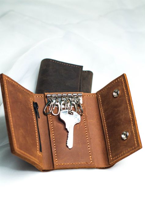 "Leather key case & coin pouch!  Key Organizer, Key Holder Pouch We will help to keep all your keys together. And thanks to additional departments, you can use it both as a wallet and as a key holder! ⭐genuine leather; ⭐100 % handmade; ⭐Size - 11x7 cm; (4,3x2,8 inch) ⭐ 6 keychain fixing hooks; ⭐compartment for banknotes; ⭐coin compartment PERSONALIZATION We can do initials, text or name on any item. To make your item personalized 1. Choose \"Color + Personalization\" in the \"Color & Personalization\" menu. 2. Leave the text for engraving + place for it on the item in the Personalization box; ✈️ DELIVERY ✈️ - Standard shipping (Usual shipping time is 2-6 weeks depending on destination) - Express shipping (5-10 business days), available upon request https://www.etsy.com/listing/856683752/pa Key Case Holder, Key Holder Wallet, Leather Key Holder, Leather Key Case, Key Wallet, Leather Key Fobs, Key Organizer, Key Bag, Leather Dye