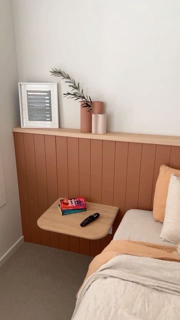 Surround by Laminex on Instagram: "This stunning project by @hammerandstone_workroom features our timeless Classic VJ 100 profile painted in @duluxaus Clay Court as a wall to wall bed head with a decorative ledge - Perfect for adding finishing touches to complete the space. Easy to install and ready to paint, this single wall feature adds so much depth and texture to this bedroom. Spruce up your room this Spring with Surround by Laminex. Love this look? Visit the link in our bio for more inspir Bedroom Feature Wall Behind Bed, Wall Headboard With Shelves, Built In Shelf Behind Bed, Entire Wall Headboard, Ledge Headboard Wall, Half Wall Ledge Bedroom, Headboard Ledge Wall, No Bed Head Bedroom Ideas, Scallop Wall Panelling