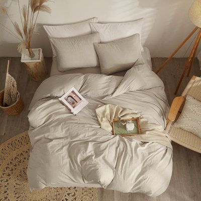 The simple style of the washed cotton duvet set, its material is soft and breathable, and the natural ruffled texture adds a retro atmosphere, providing you with a more relaxed and comfortable lifestyle. The washed cotton duvet set comes in a variety of colors and sizes to complement a variety of home decor styles. Size: Full Duvet Cover + 2 Standard Pillowcases, Color: Beige Tan | Ebern Designs Washed Cotton Duvet Cover Set Cotton in White | Full Duvet Cover + 2 Standard Pillowcases | Wayfair | Taupe Sheets Bedding, Tan Linen Bedding, Cream Duvet Bedding Ideas, Earthy Bedding Sets, Tan Comforter Bedroom, Blue And Beige Bedding, Beige Bedding Aesthetic, Beige Comforter Bedroom Ideas, Light Brown Bedding