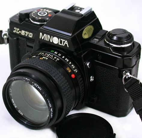 BEAUTIFUL Condition Minolta X-570 FILM CAMERA w/Minolta 50mm f:1.7 Lens! (45mm lens may be substituted at our discretion depending on availability) ** Please Note: This is a FILM camera, NOT a digital camera ** Perfect for a photography class; or just an easy to use film camera for everyday use!  Camera takes great photos. Includes Genuine Minolta 45mm Lens, Lens Cap, Shoulder/Neck Strap, & even a fresh set of Batteries ($15-19+ value!) You'll also receive a pdf file of the Original Minolta Manu Minolta Camera, Lens Cap, Photography Classes, Film Camera, Neck Strap, F 1, Great Photos, Step Up, Digital Camera