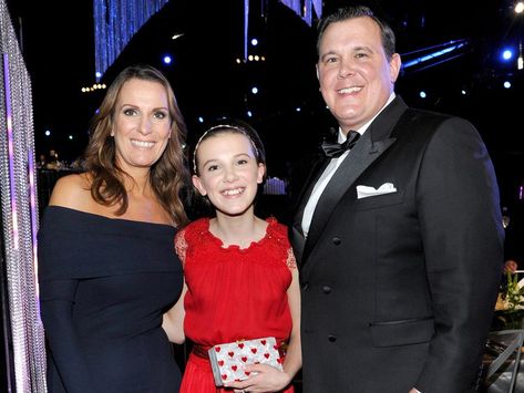 All About Millie Bobby Brown’s Parents, Robert and Kelly Brown Growing Up With Siblings, Kelly Brown, Shave Her Head, Raised Eyebrow, Watch Cartoons, Moving To California, Celebrity Biographies, Enola Holmes, First Daughter